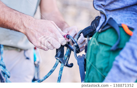 Rock climbing, mountain and people with rope and harness for adventure, freedom and extreme sports. Fitness, nature and man and woman attach equipment or gear for training, activity and challenge Rock climbing, mountain and people with rope and harness for adventure, freedom and extreme sports. Fitness, nature and man and woman attach equipment or gear for training, activity and challenge 138871352