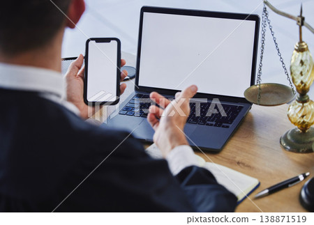Phone screen, laptop and working at desk, office or lawyer reading communication, contract or information technology mockup. Mobile app, software on computer and cellphone for internet or web search Phone screen, laptop and working at desk, office or lawyer reading communication, contract or information technology mockup. Mobile app, software on computer and cellphone for internet or web search 138871519