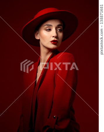 Idea, fashion and woman in red hat in studio isolated on a background with suit. Makeup, cosmetics and female model in fedora, serious style and classy clothes with aesthetic, vision and thinking. Idea, fashion and woman in red hat in studio isolated on a background with suit. Makeup, cosmetics and female model in fedora, serious style and classy clothes with aesthetic, vision and thinking. 138871681