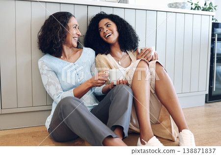 Love, mother and adult daughter on floor, speaking and quality time on weekend, relax and chatting. Mama, family and girl on ground, drinking coffee or conversation with happiness, resting and lounge 138871837