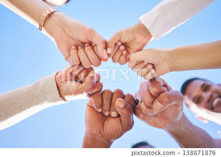 Big family, fist bump and teamwork synergy in circle for support, trust or unity in collaboration outdoors. Low angle of people or friends touching hands for team building, community or goals outside Big family, fist bump and teamwork synergy in circle for support, trust or unity in collaboration outdoors. Low angle of people or friends touching hands for team building, community or goals outside 138871876