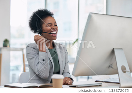 Black woman, call center and celebration for winning, promotion or sale in telemarketing at the office desk. Happy African female consultant or agent celebrating win, bonus or victory by computer 138872075
