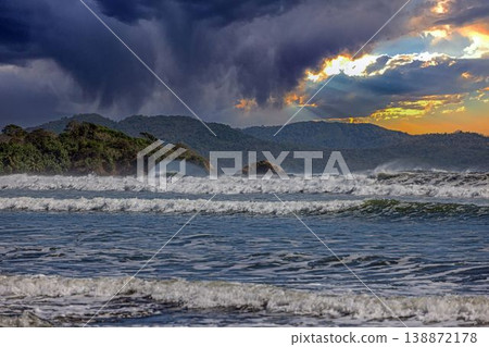 Sun rays over waves and tropical coast Panama Sun rays over waves and tropical coast Panama 138872178