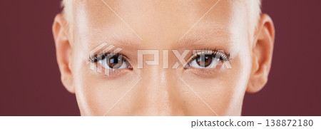 Portrait, woman eyes and beauty makeup with mascara and eyebrows bleached in a studio. Cosmetics, eyebrow treatment and self care for lashes close up of a young model with isolated brown background 138872180