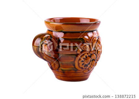 Vintage glazed ceramic mug produced by the famous Vasylkiv pottery plant, featuring traditional Ukrainian floral ornament and warm brown tones, isolated on white background. 138872215