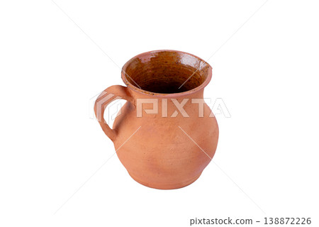 Rustic Clay Pitcher with Handle Isolated on White. Antique Rustic earthenware jug with Aged Terracotta surface Rustic Clay Pitcher with Handle Isolated on White. Antique Rustic earthenware jug with Aged Terracotta surface 138872226