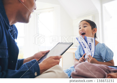 Happy little girl, father and tablet with tickets for travel, vacation or holiday getaway together at home. Dad and excited daughter, child or kid and boarding pass for weekend journey or flight trip Happy little girl, father and tablet with tickets for travel, vacation or holiday getaway together at home. Dad and excited daughter, child or kid and boarding pass for weekend journey or flight trip 138872231