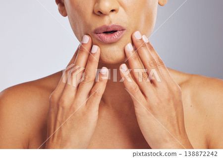 Lips, pouting or hands of a woman for skincare, beauty or dermatology wellness. Closeup, anti aging and mouth or manicure of a model for cosmetic nails or glow isolated on a studio background Lips, pouting or hands of a woman for skincare, beauty or dermatology wellness. Closeup, anti aging and mouth or manicure of a model for cosmetic nails or glow isolated on a studio background 138872242