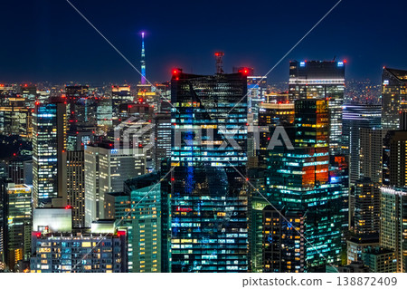 A night view of the Roppongi skyscrapers and Tokyo Skytree from Roppongi Hills in Minato Ward, Tokyo. 138872409