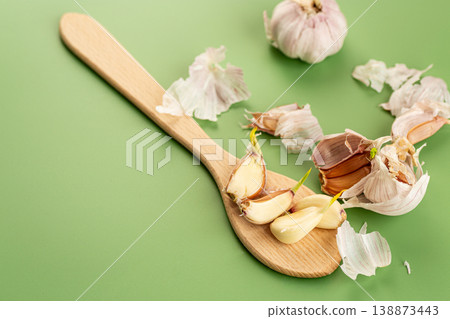 organic garlic vegetable ingredient minimal green background organic garlic vegetable ingredient minimal green background 138873443