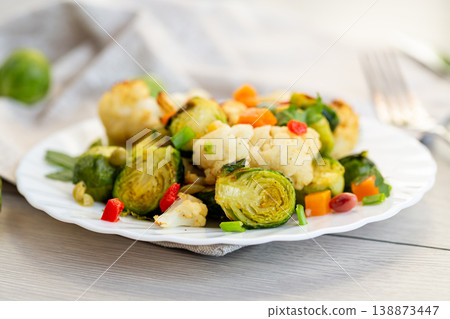 healthy roasted vegetable mix with brussels sprouts on plate healthy roasted vegetable mix with brussels sprouts on plate 138873447