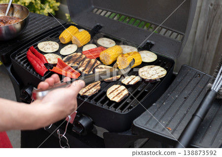 Grilling vegetables on outdoor bbq with mixed vegetables on open grill Grilling vegetables on outdoor bbq with mixed vegetables on open grill 138873592