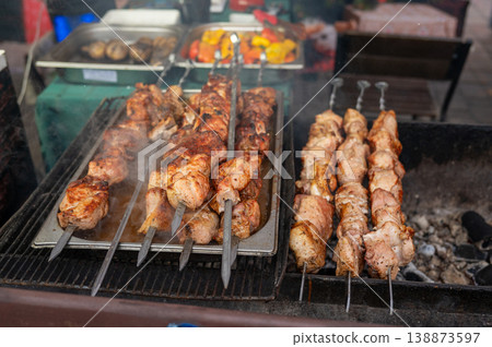 Grilled meat skewers on outdoor barbecue grill Grilled meat skewers on outdoor barbecue grill 138873597