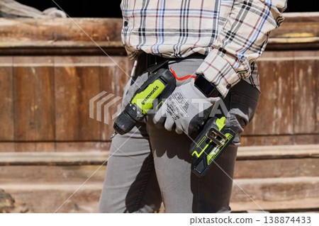 Maintenance person standing with illuminated cordless tools 138874433