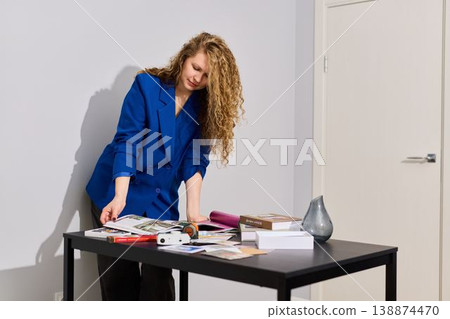 Female content producer choosing photo captions carefully Female content producer choosing photo captions carefully 138874470