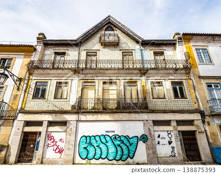 Tomar, Portugal - Mar 11, 2026: A charming cobblestone street in Tomar, Portugal. 138875393