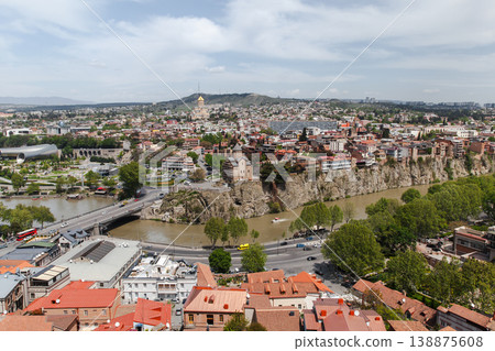 Aerial view of Tbilisi, Georgia showing the Mtkvari river 138875608