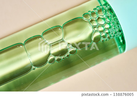 Green liquid cosmetic serum with air bubbles Green liquid cosmetic serum with air bubbles 138876005