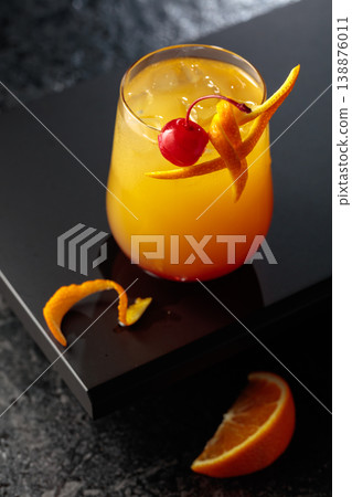 Cocktail Tequila sunrise with orange juice, silver tequila, grenadine, and ice. 138876011