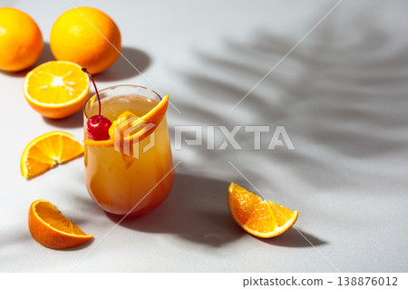 Cocktail Tequila sunrise with orange juice, silver tequila, grenadine, and ice. 138876012