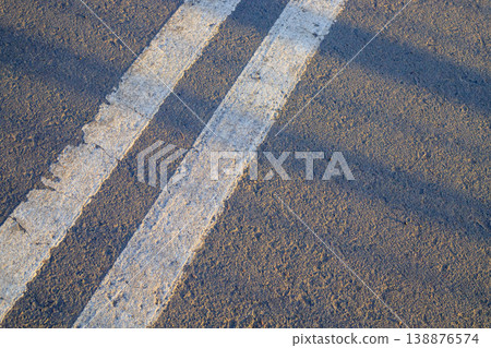 Double white dividing strip on the asphalt of the road. 138876574