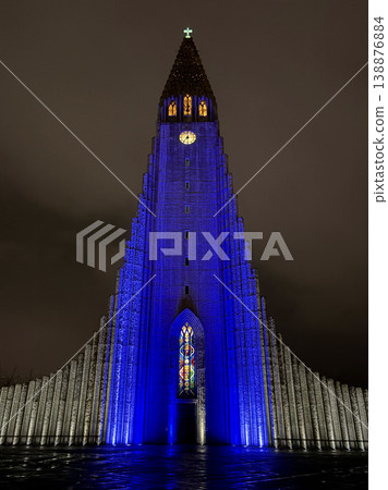 Hallgrimskirkja church at night with blue illumination, iconic landmark of Reykjavik, Iceland. Hallgrimskirkja church at night with blue illumination, iconic landmark of Reykjavik, Iceland. 138876884