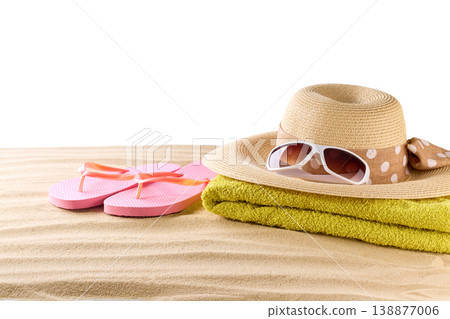 pink flip flops with straw beach hat and sunglasses on a beach sand, isolated on a white background. 138877006
