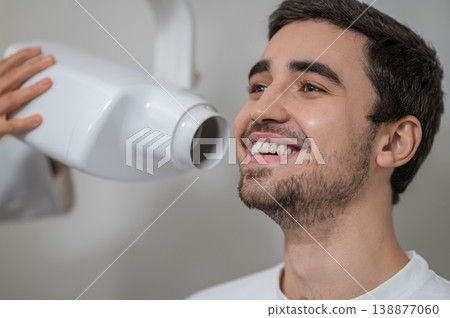 Close up of patient receiving dental x-ray scan Close up of patient receiving dental x-ray scan 138877060