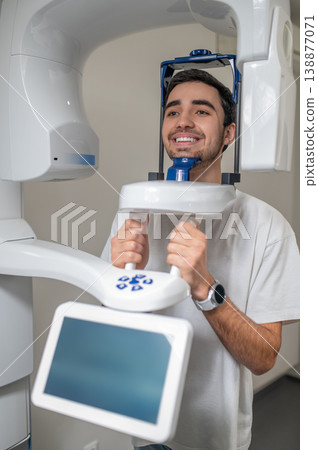 Male patient using dental cone beam computed tomography 138877071