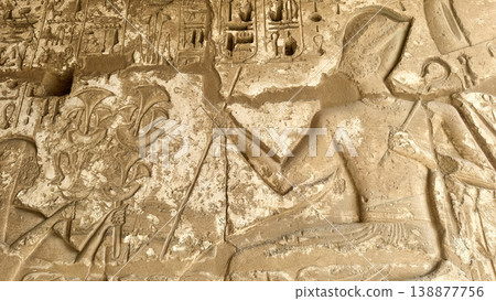 Beautiful bas-reliefs and ancient hieroglyphs from the mortuary temple of Ramesses III at Medinet Habu, Luxor, Egypt. Beautiful bas-reliefs and ancient hieroglyphs from the mortuary temple of Ramesses III at Medinet Habu, Luxor, Egypt. 138877756
