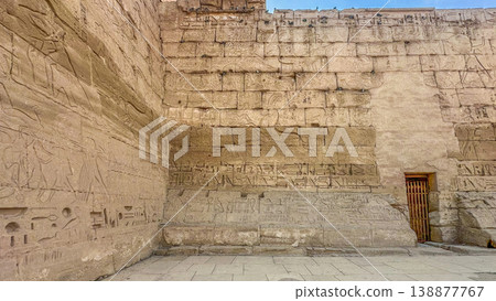 Medinet Habu, the mortuary temple of Ramesses III, located on the west bank of Luxor, Egypt. 138877767