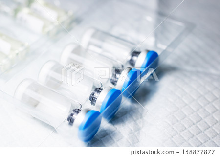 Clinically prepared syringes arranged in sterile setup for vaccine administration 138877877