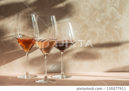 Three Wine Glasses with Rose, White and Red Wine. Three Wine Glasses with Rose, White and Red Wine. 138877911