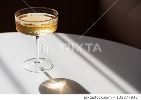 Champagne Glass with Golden Sparkle. Festive Celebration Champagne Glass with Golden Sparkle. Festive Celebration 138877938