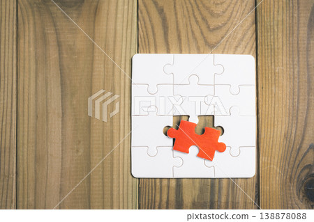 A puzzle piece is missing from a puzzle 138878088