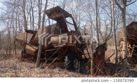 Closeup Of Broken Tractor Cabin, Windowless Frame And Rusted Controls With Peeling Paint, Birch Trunks Framing Closeup Of Broken Tractor Cabin, Windowless Frame And Rusted Controls With Peeling Paint, Birch Trunks Framing 138878390