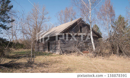 Dilapidated Wooden Cottage Beside Birch Trees, Sagging Roof, Peeling Paint, Small Chimney, Surrounding Tall Dilapidated Wooden Cottage Beside Birch Trees, Sagging Roof, Peeling Paint, Small Chimney, Surrounding Tall 138878391