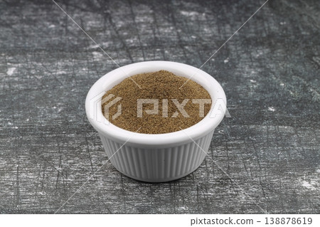 Freshly ground organic black pepper in rustic bowl over wooden surface. Healthy food seasoning Freshly ground organic black pepper in rustic bowl over wooden surface. Healthy food seasoning 138878619