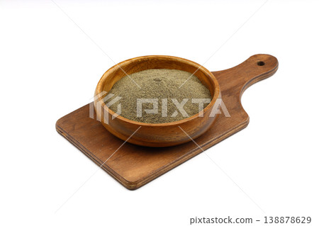 Ground black pepper spice in a wooden bowl isolated on white background. Top view, close-up Ground black pepper spice in a wooden bowl isolated on white background. Top view, close-up 138878629