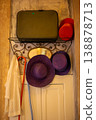 Collection of Vintage Hats and Suitcase on a Shelf 138878713