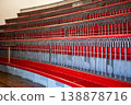Historic auditorium interior, red benches, wooden table, vintage architecture, empty hall 138878716