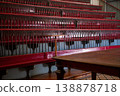 Historic Auditorium Interior with Red Benches and Wooden Table 138878718
