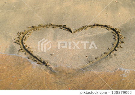Heart drawn on the beach sand 138879093