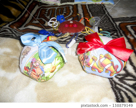 A cushion made of cloth. Toy pillows for children. Homemade toys. A cushion made of cloth. Toy pillows for children. Homemade toys. 138879149