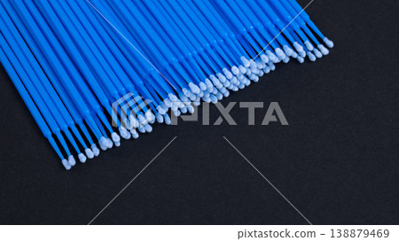 Close-up of blue disposable microbrush applicators for eyelash extension on black background Close-up of blue disposable microbrush applicators for eyelash extension on black background 138879469