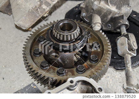 Dismantled box car transmissions. The gears on the shaft of a mechanical transmission. Dismantled box car transmissions. The gears on the shaft of a mechanical transmission. 138879520