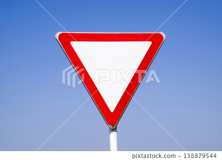 Road signs, give way. Sign on a blue background Road signs, give way. Sign on a blue background 138879544