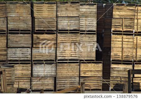 Wooden boxes stacked together 138879576