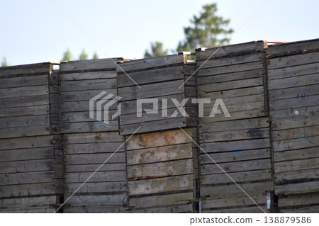 Wooden boxes stacked together 138879586