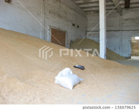 Heap of grains of barley and wheat in stock Heap of grains of barley and wheat in stock 138879625